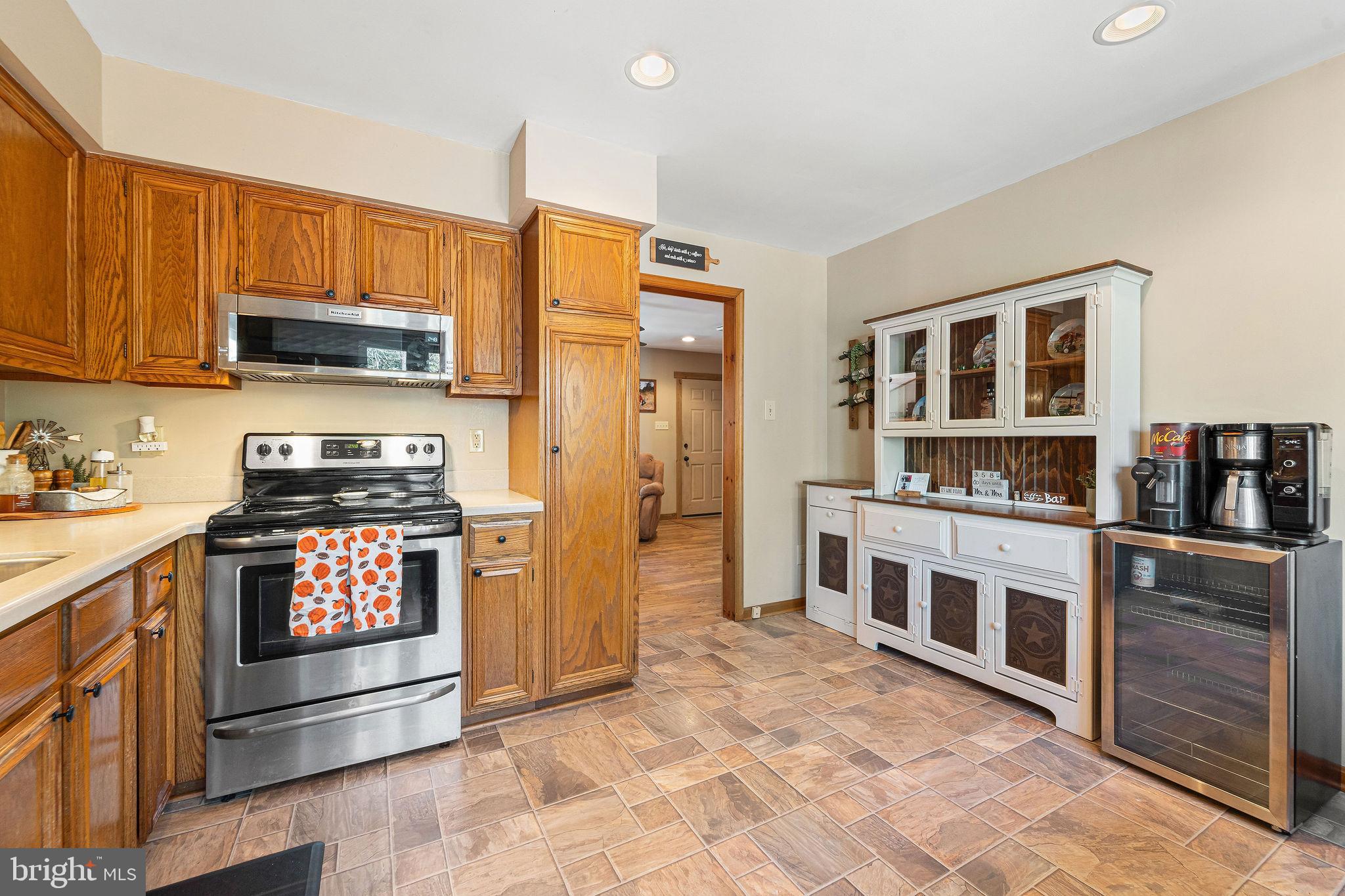 16 Laurel Trail Bridgeton, NJ 08302 - Photo 18 of 31 a kitchen with stainless steel appliances granite countertop a stove top oven a sink and dishwasher