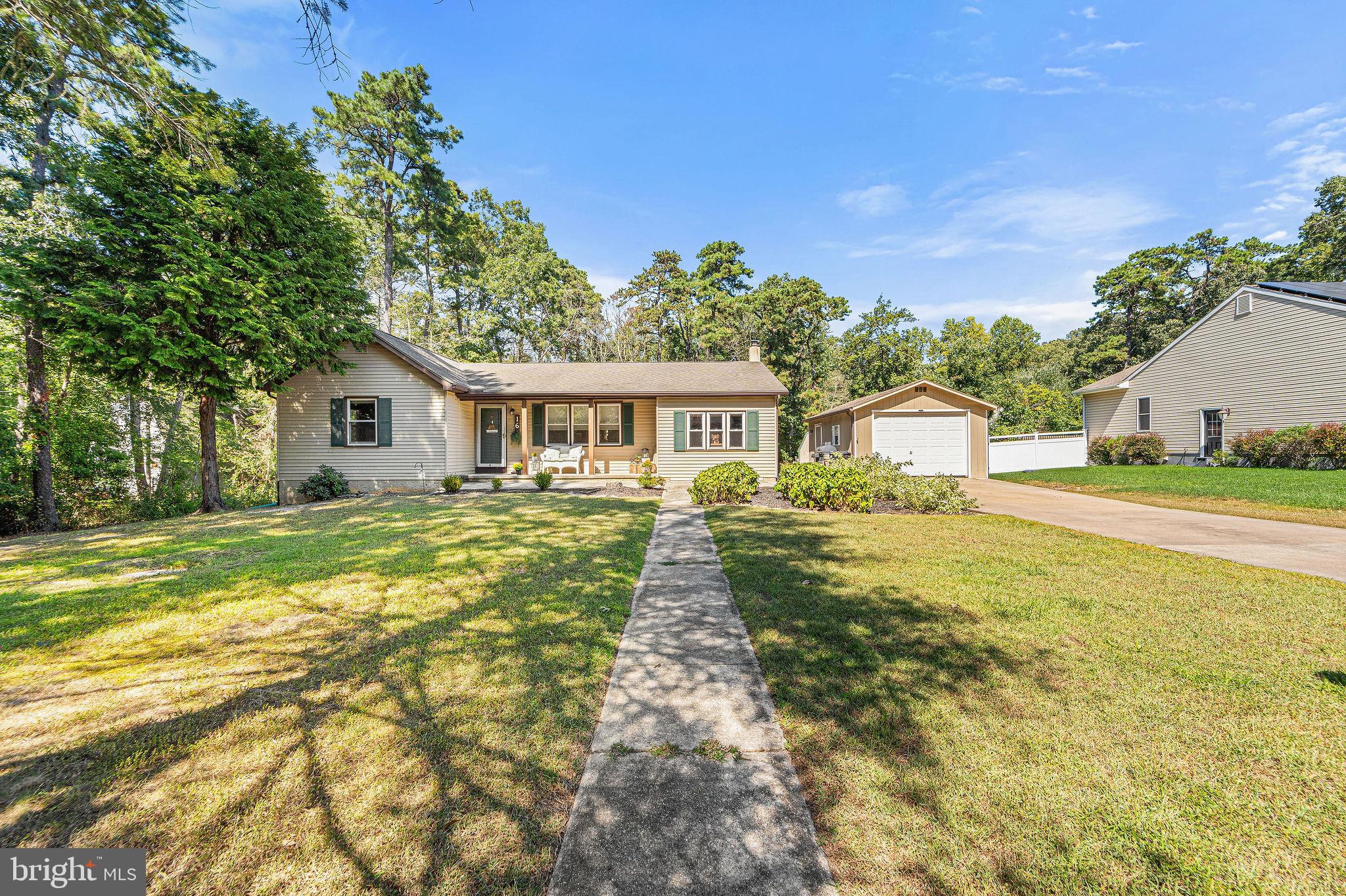 16 Laurel Trail Bridgeton, NJ 08302 - Photo 2 of 31 a front view of a house with a yard