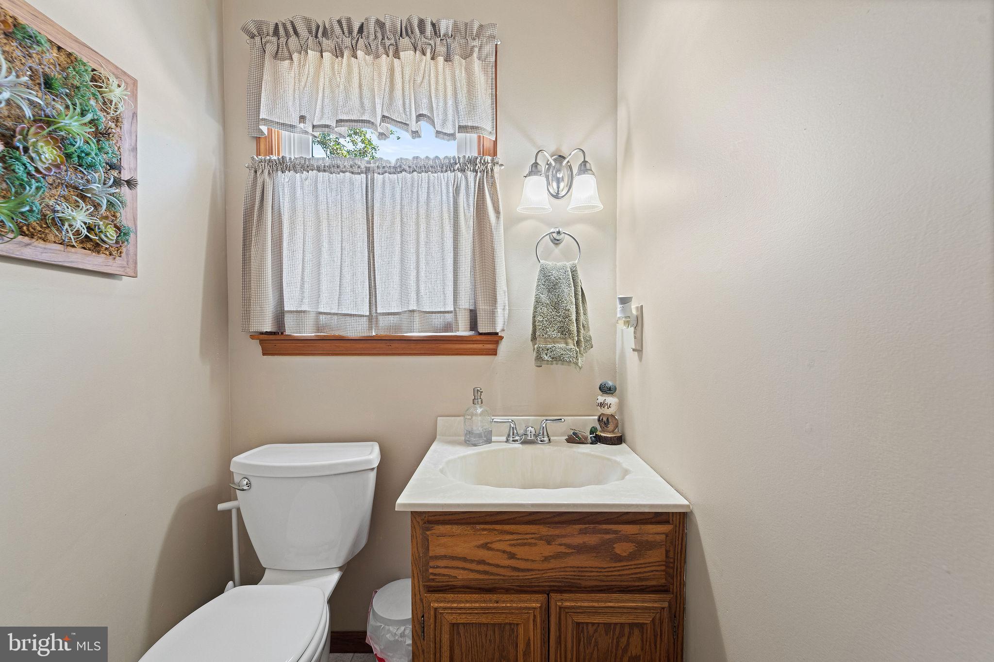16 Laurel Trail Bridgeton, NJ 08302 - Photo 23 of 31 a bathroom with a sink a toilet and mirror