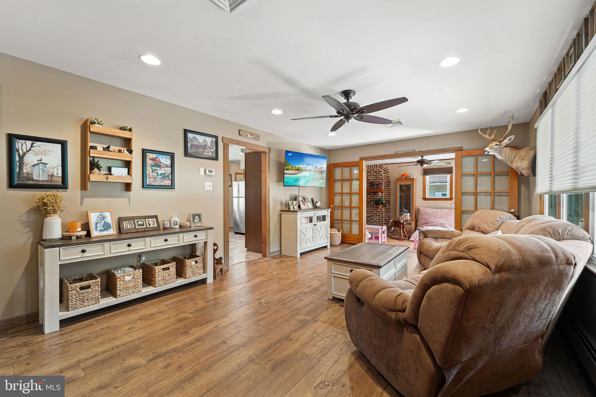 16 Laurel Trail Bridgeton, NJ 08302 - Photo 27 of 31 a living room with furniture fireplace and a large window