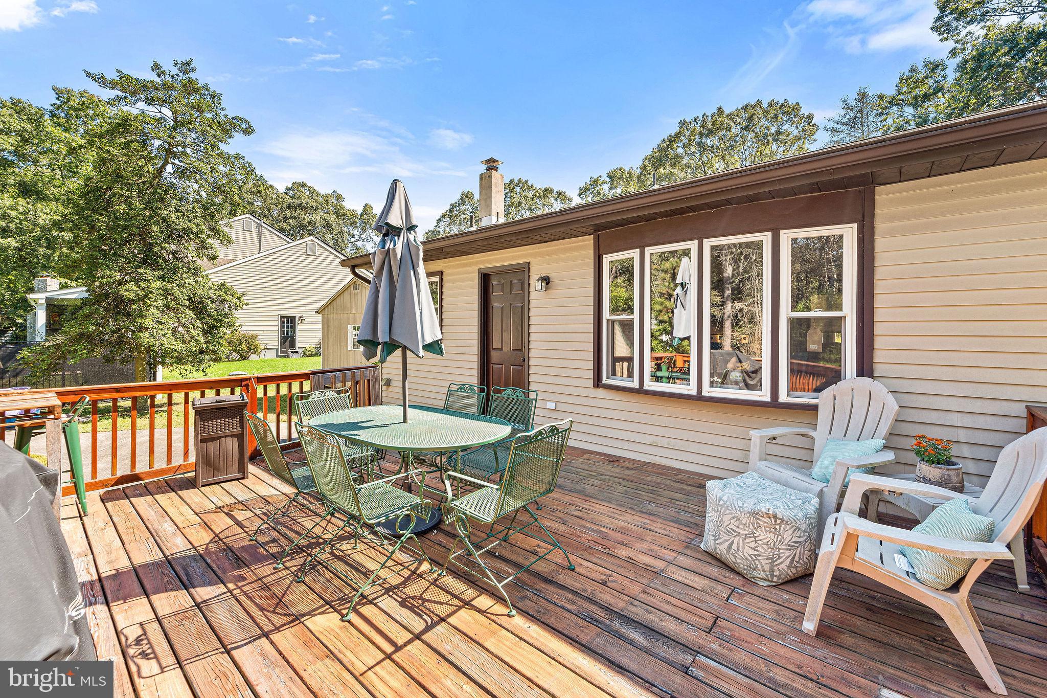 16 Laurel Trail Bridgeton, NJ 08302 - Photo 4 of 31 a view of a chair and tables on the roof deck