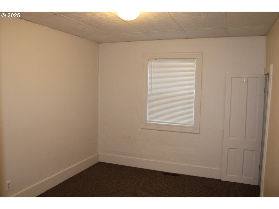 229 Darwin Street Athena, OR 97813 - Photo 12 of 18 a view of an empty room with a window