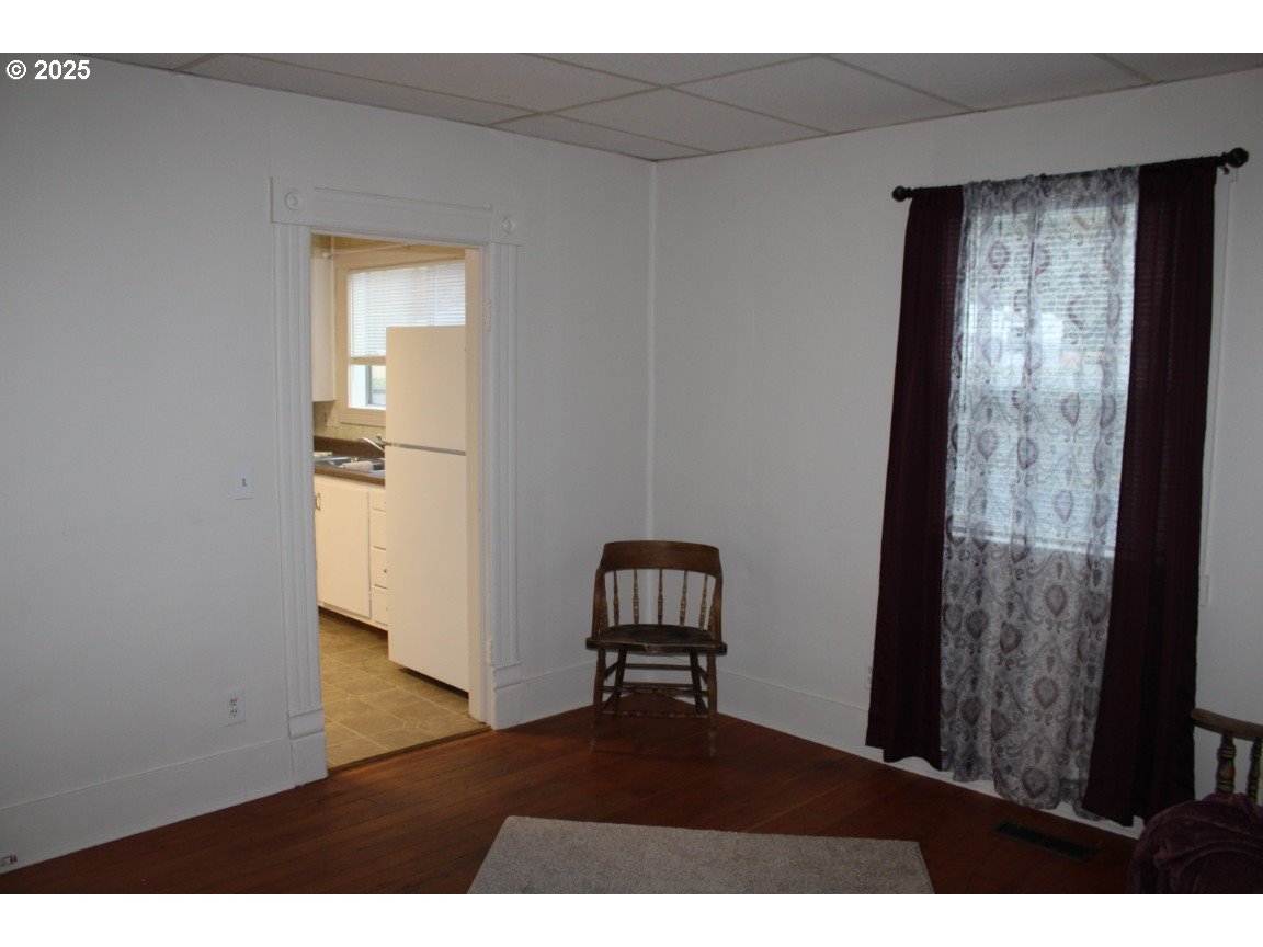 229 Darwin Street Athena, OR 97813 - Photo 5 of 18 a view of an empty room and wooden floor