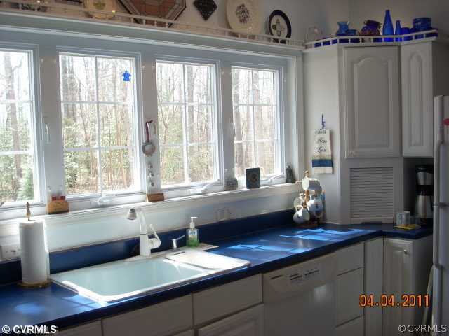 13824 Cross County Road Mineral, VA 23117 - Photo 11 of 12 a kitchen with a window a sink and a counter top space