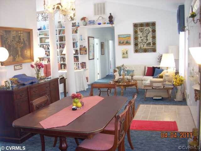 13824 Cross County Road Mineral, VA 23117 - Photo 4 of 12 a living room with furniture a rug and a table