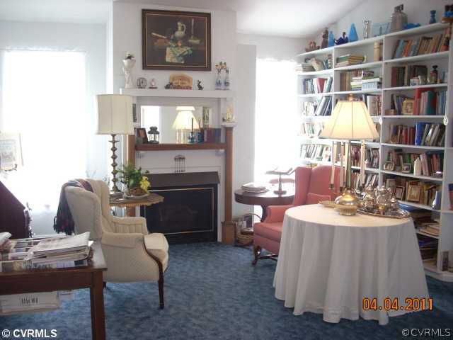 13824 Cross County Road Mineral, VA 23117 - Photo 6 of 12 a living room with furniture and a book shelf