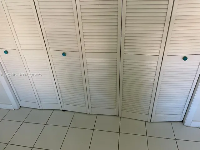 a close view of shoes stand and cabinets