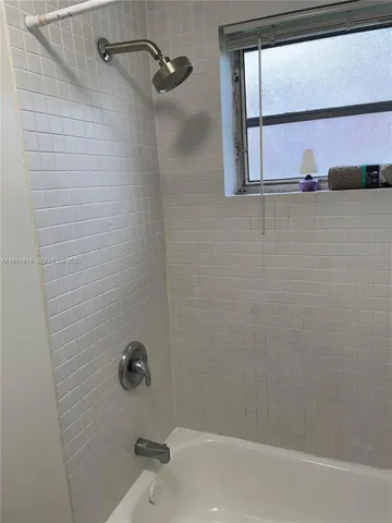 a stove top oven sitting inside of a kitchen