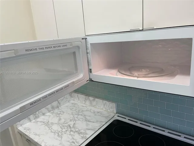 a close up of a stove top oven sitting inside of a kitchen