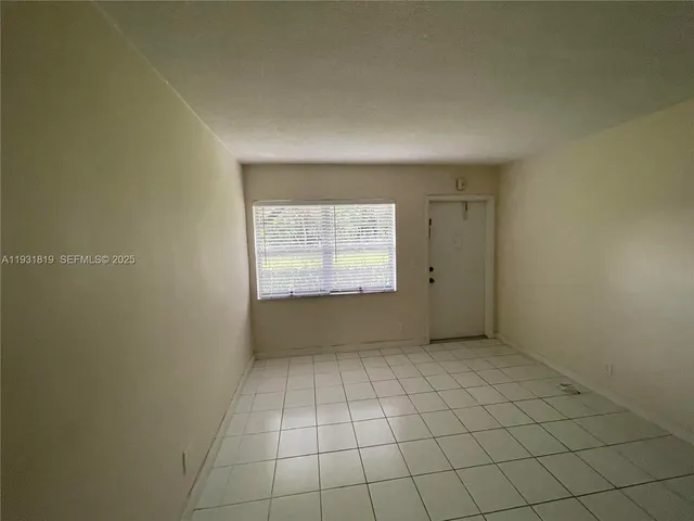 a view of an empty room with window