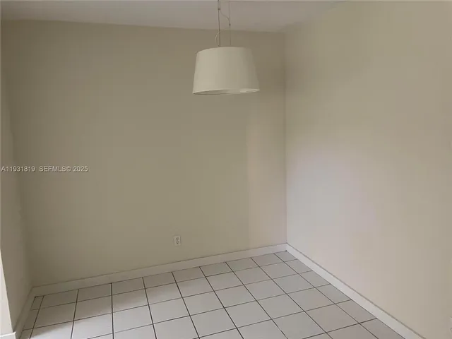 a view of a door and wooden floor