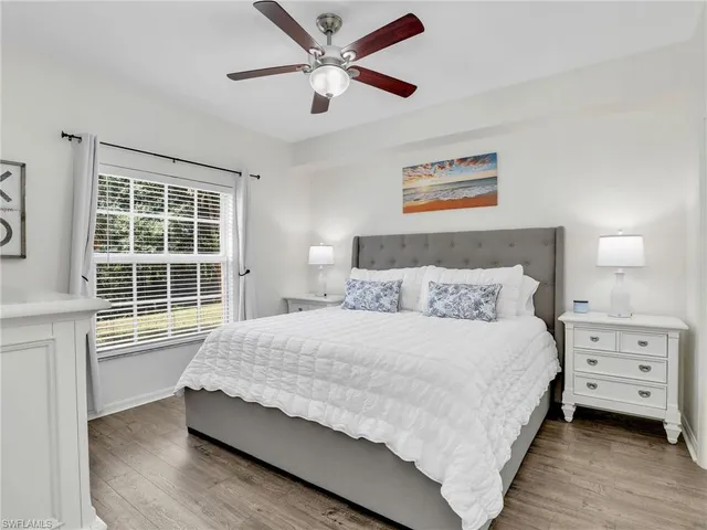 a bathroom with a double vanity sink mirror and shower