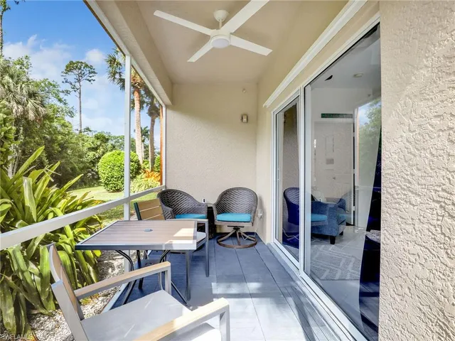 a bedroom with a large bed and a flat screen tv