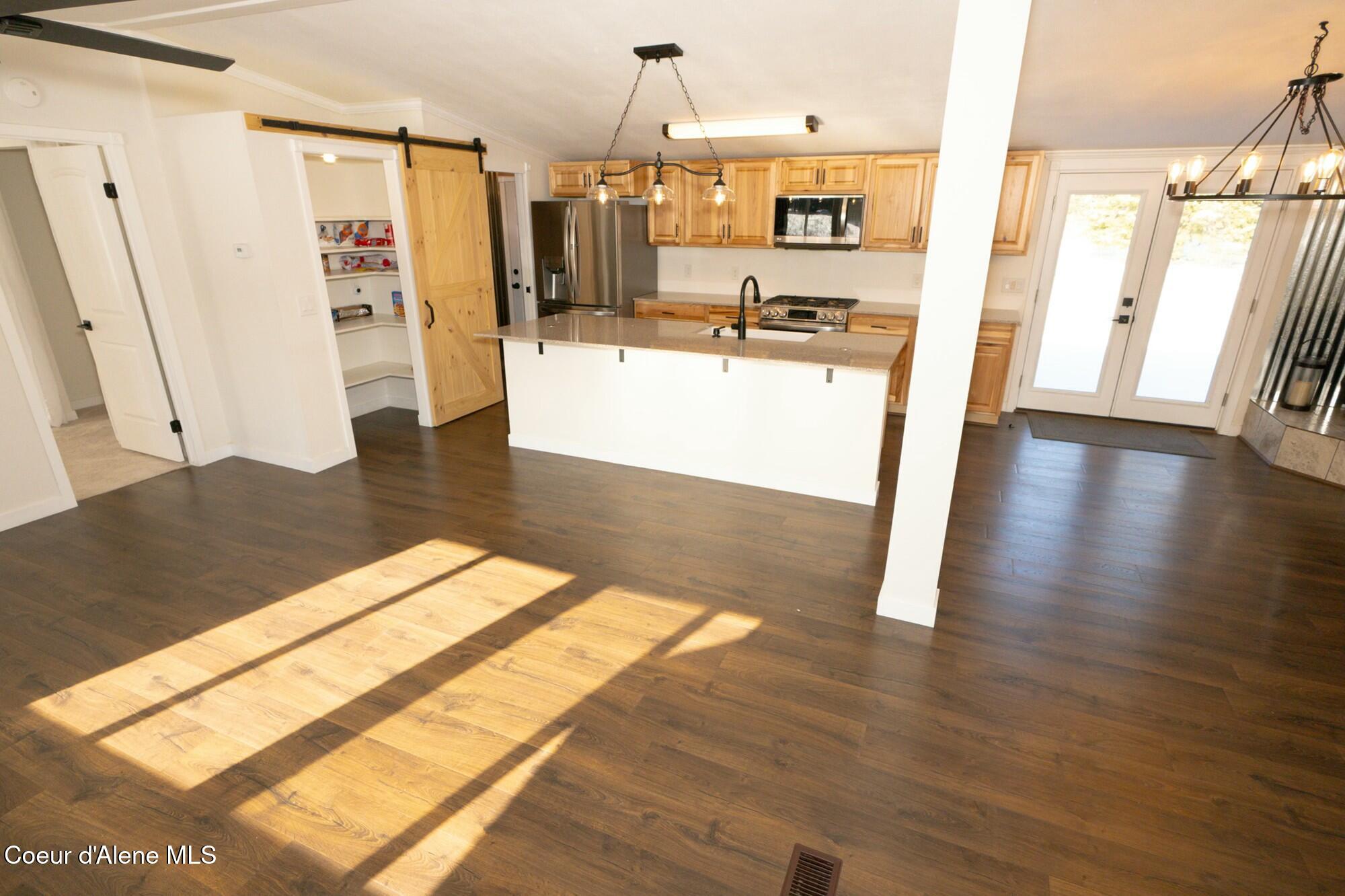 101 Wild Meadows Road Spirit Lake, ID 83869 - Photo 14 of 40 Open Kitchen/Livingroom