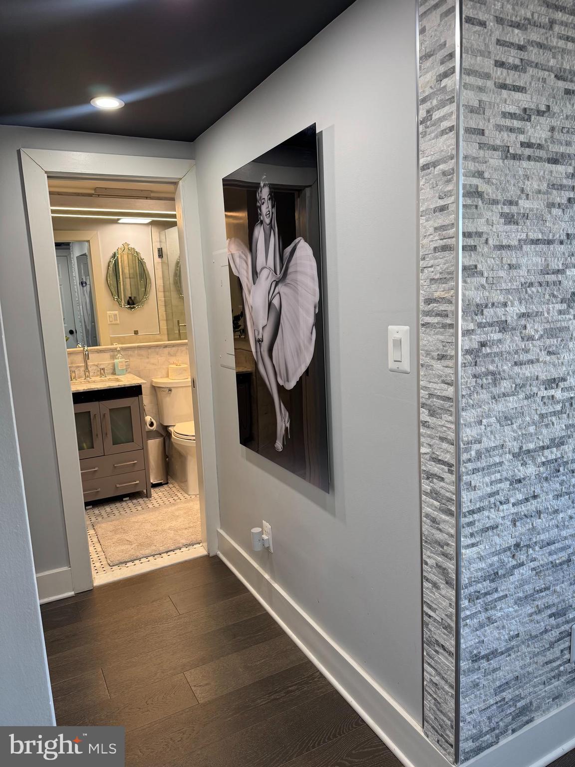 1920 S Street Northwest, Unit 603 Washington, DC 20009 - Photo 10 of 13 a view of a hallway with wooden floor and front door