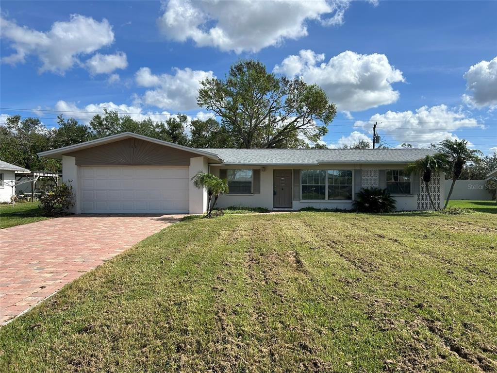 109 Peach Street Venice, FL 34285 - Photo 1 of 1 a front view of a house with a garden