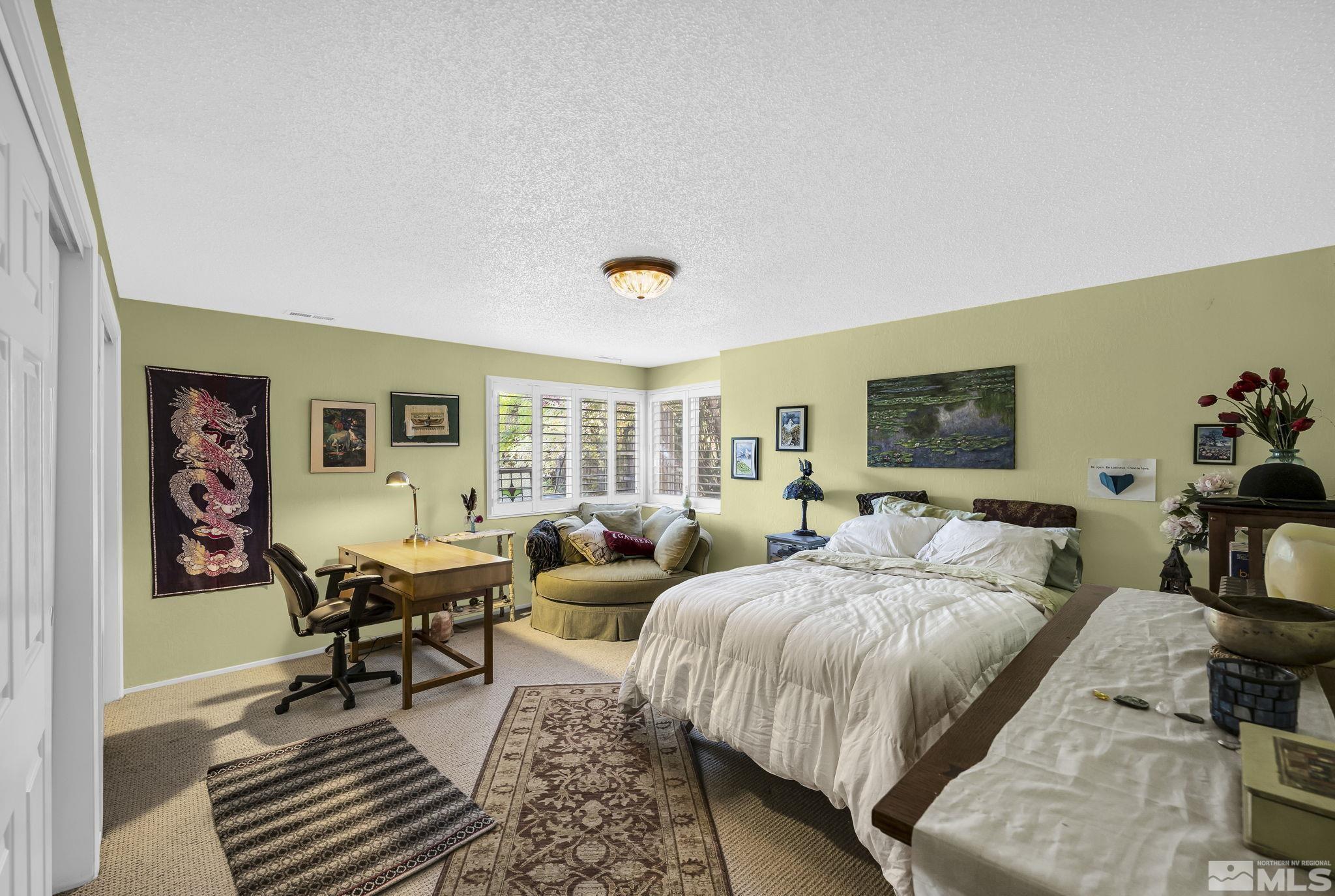 1485 Coronet Drive Reno, NV 89509 - Photo 27 of 38 a bedroom with two beds and a couch