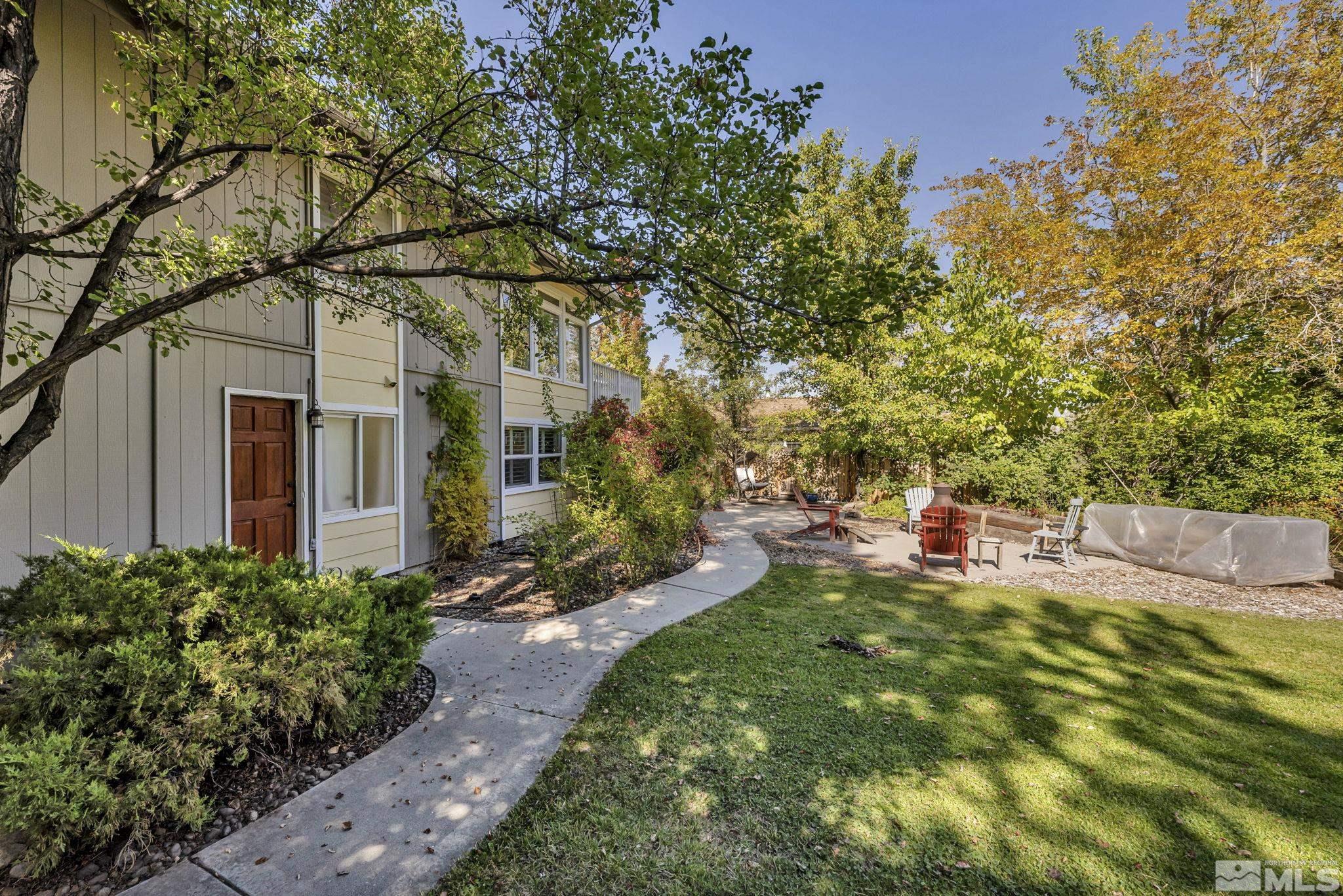 1485 Coronet Drive Reno, NV 89509 - Photo 35 of 38 a backyard of a house with table and chairs