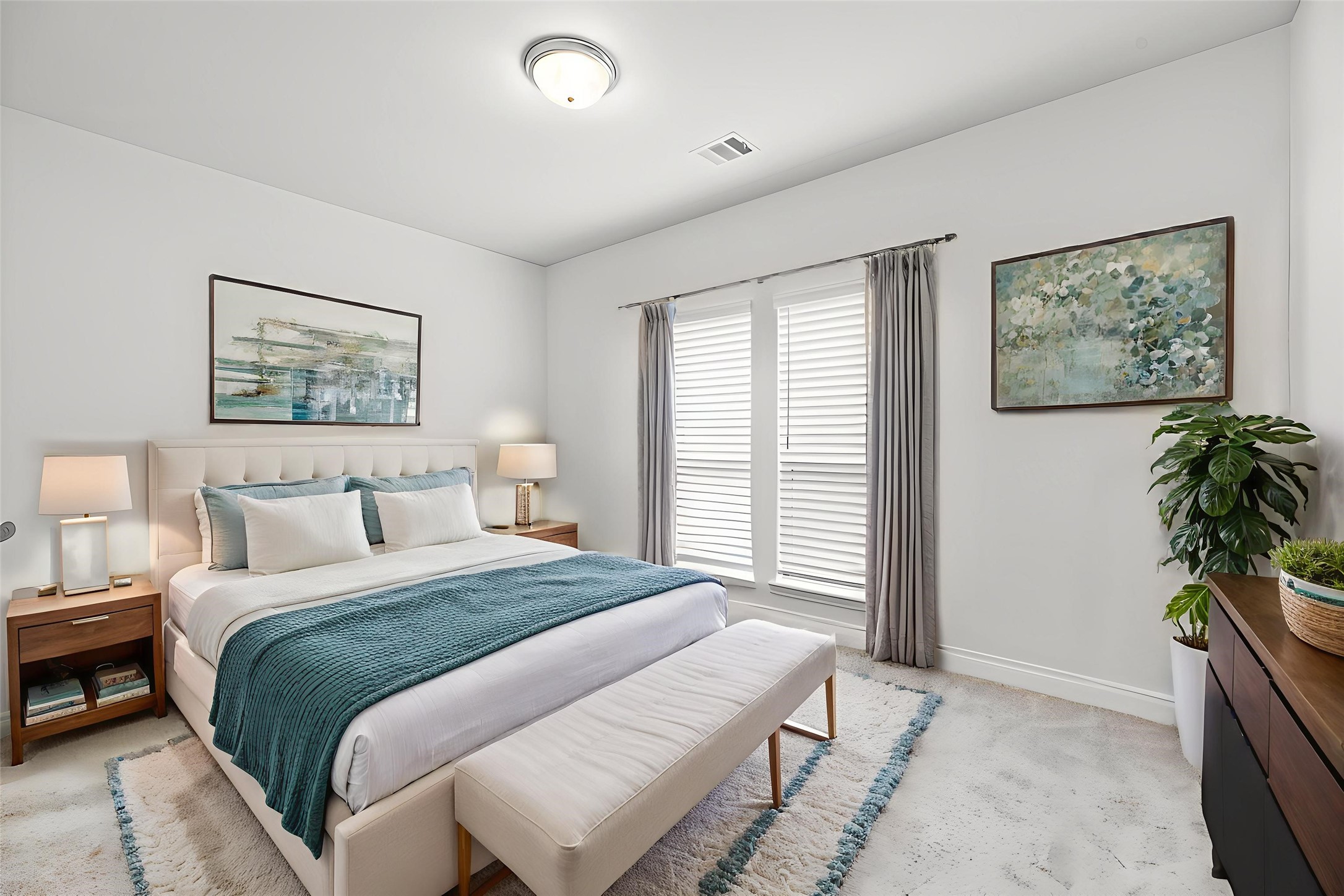 6938 Amberwing Way Katy, TX 77493 - Photo 19 of 38 a bedroom with bed and a potted plant