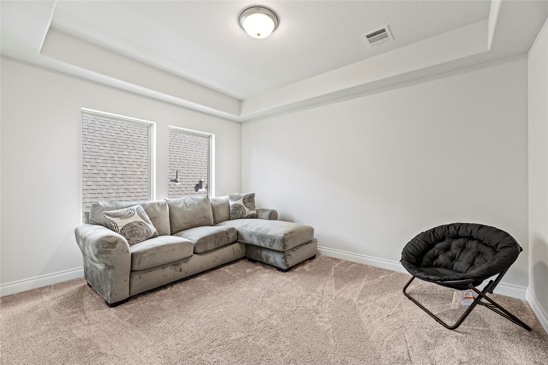 6938 Amberwing Way Katy, TX 77493 - Photo 24 of 38 a living room with furniture and a couch