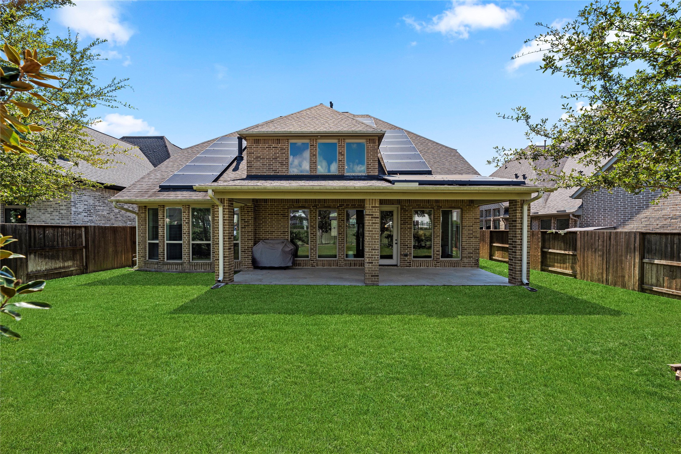 6938 Amberwing Way Katy, TX 77493 - Photo 27 of 38 a front view of a house with a garden
