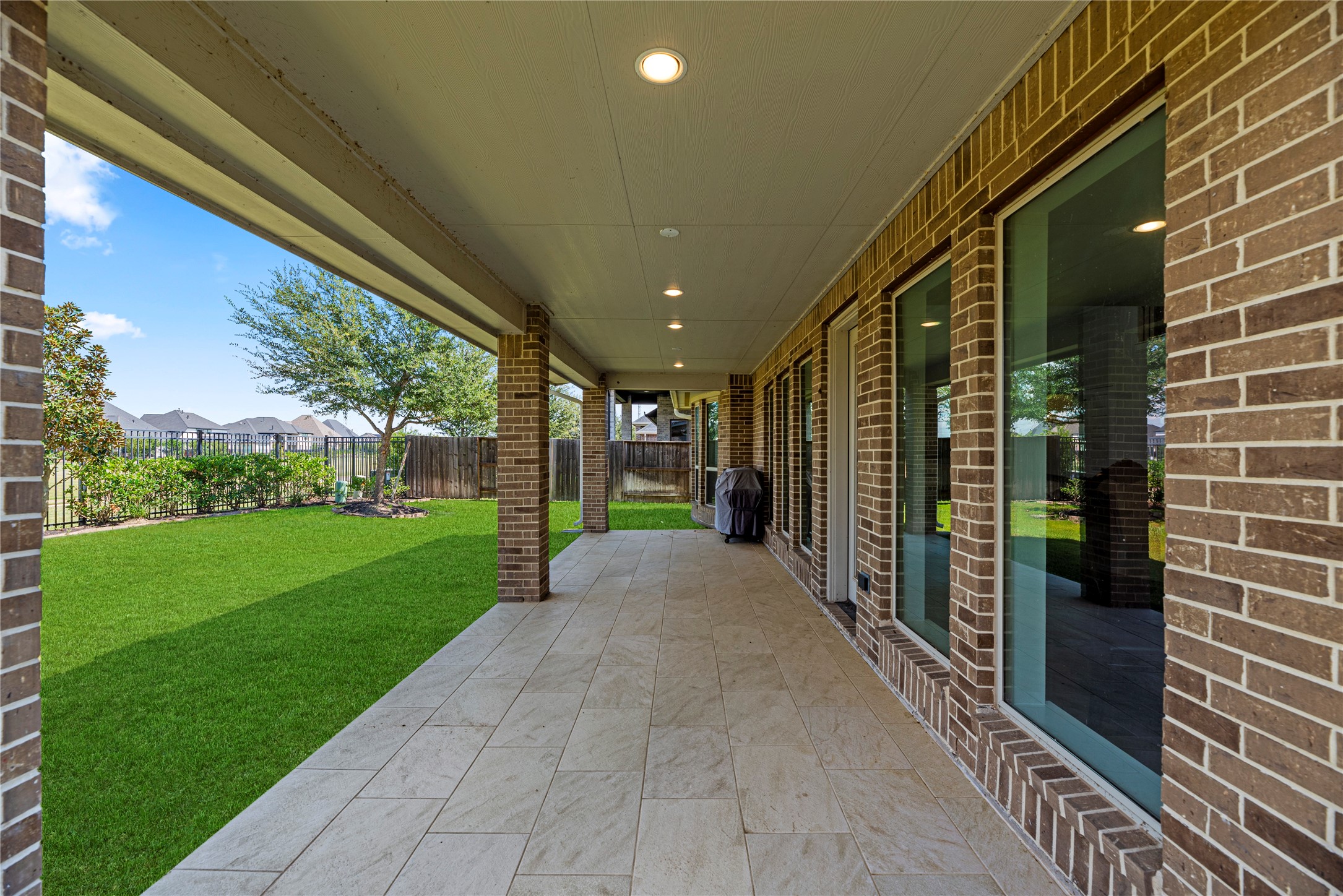 6938 Amberwing Way Katy, TX 77493 - Photo 28 of 38 a view of a porch with a backyard