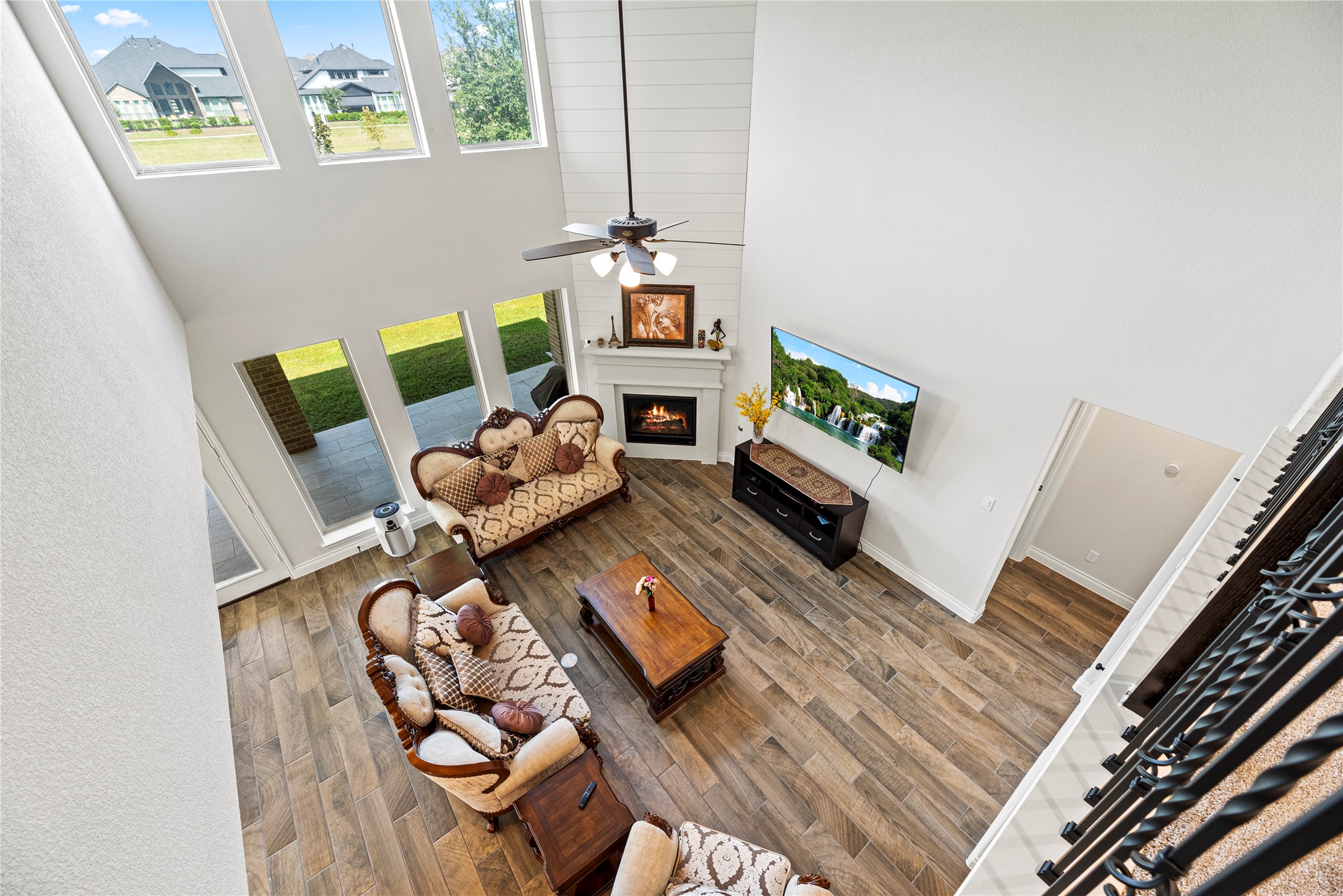 6938 Amberwing Way Katy, TX 77493 - Photo 8 of 38 a living room with furniture and a flat screen tv