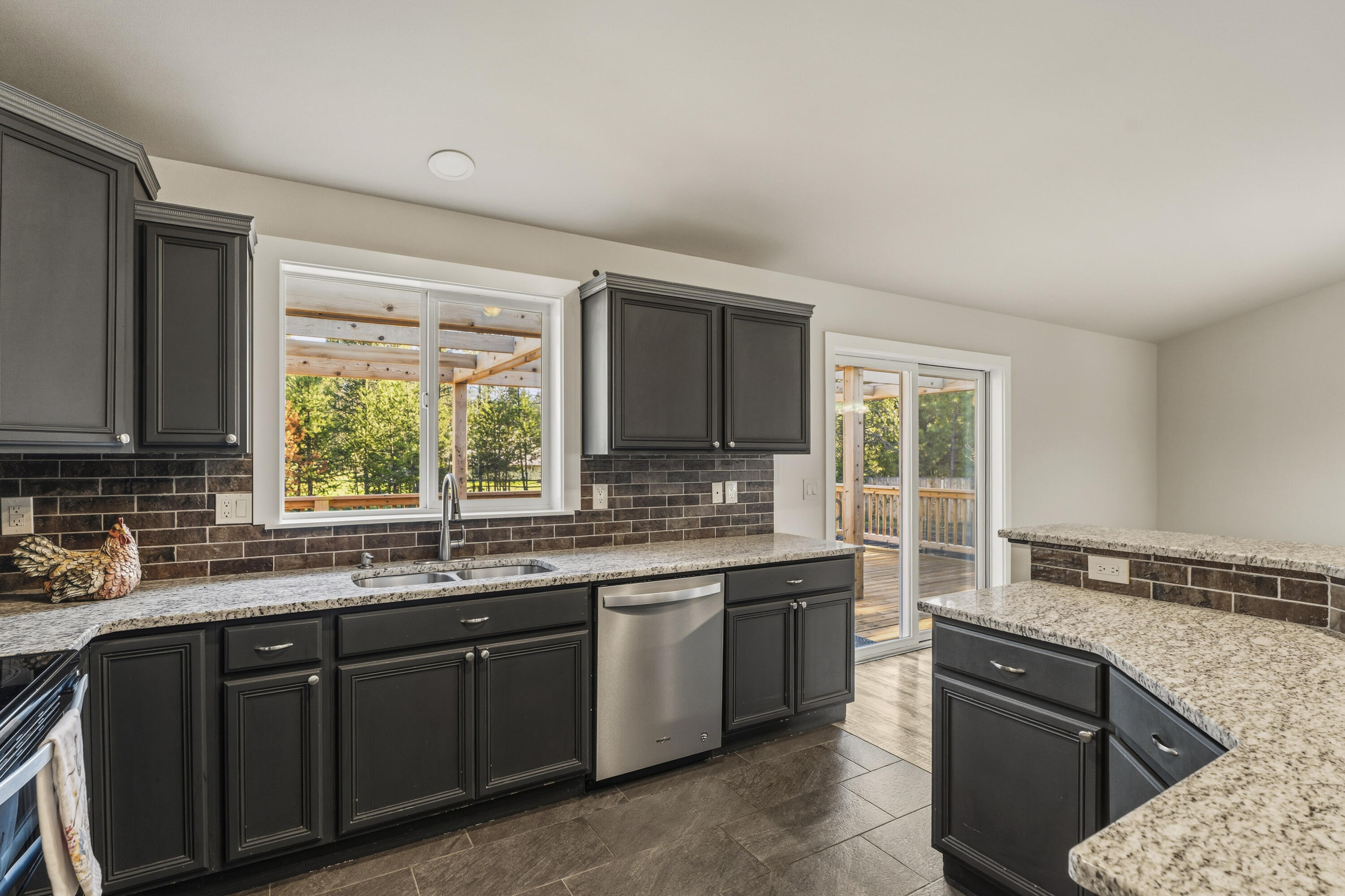 16050 Dick Road La Pine, OR 97739 - Photo 19 of 59 a kitchen with a sink stove and cabinets
