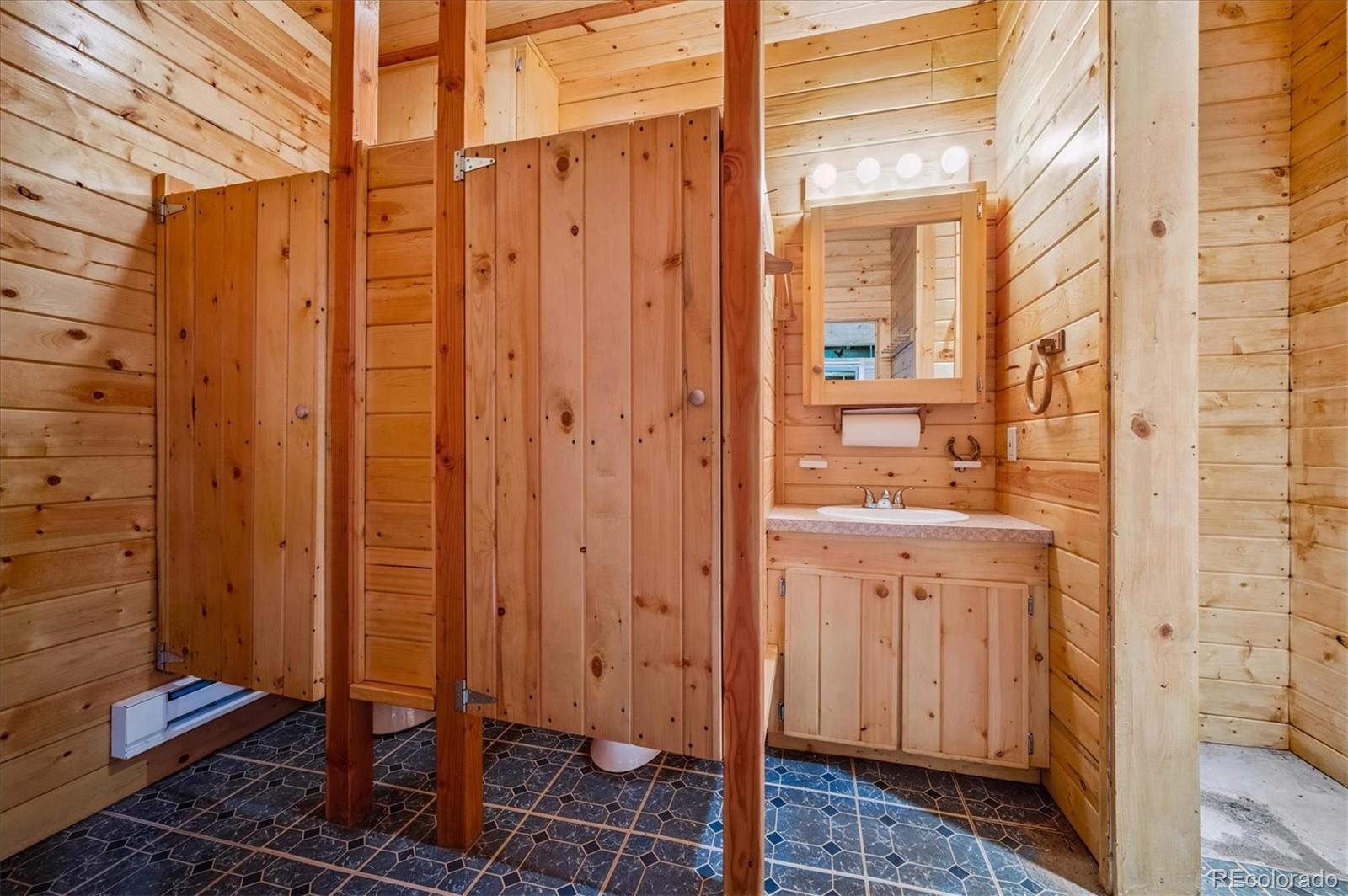 11440 West 38th Avenue Wheat Ridge, CO 80033 - Photo 12 of 18 a bathroom with a shower and a sink