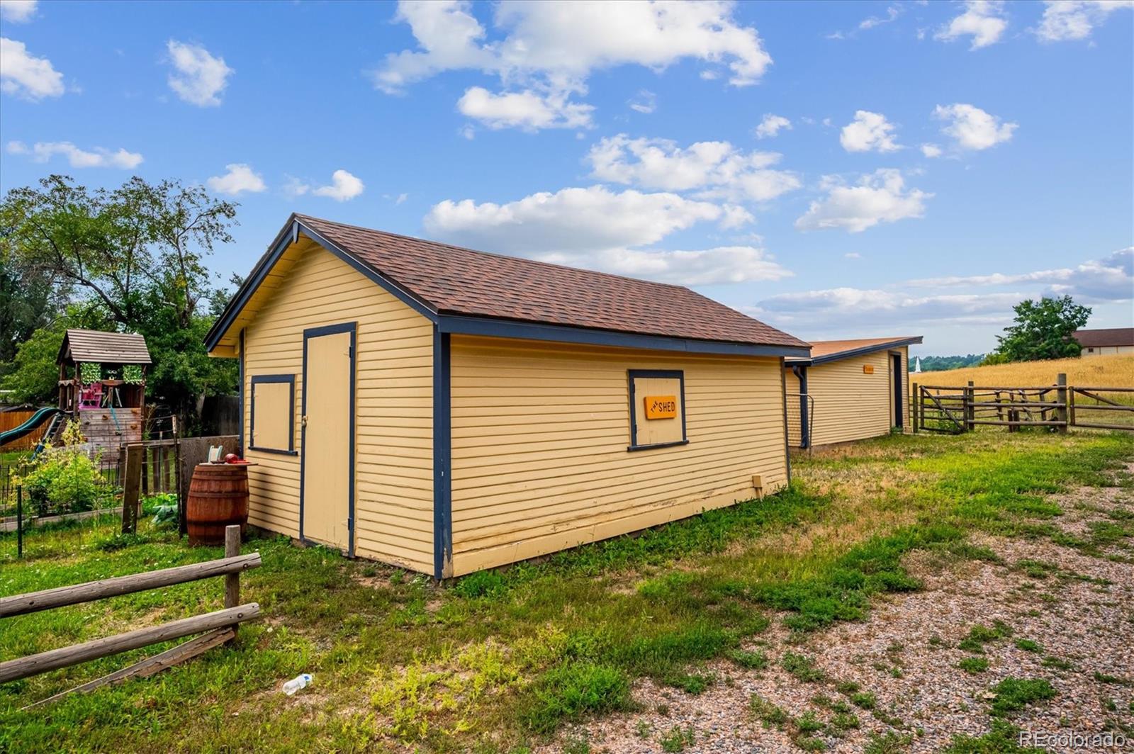11440 West 38th Avenue Wheat Ridge, CO 80033 - Photo 15 of 18 a view of a house with a yard