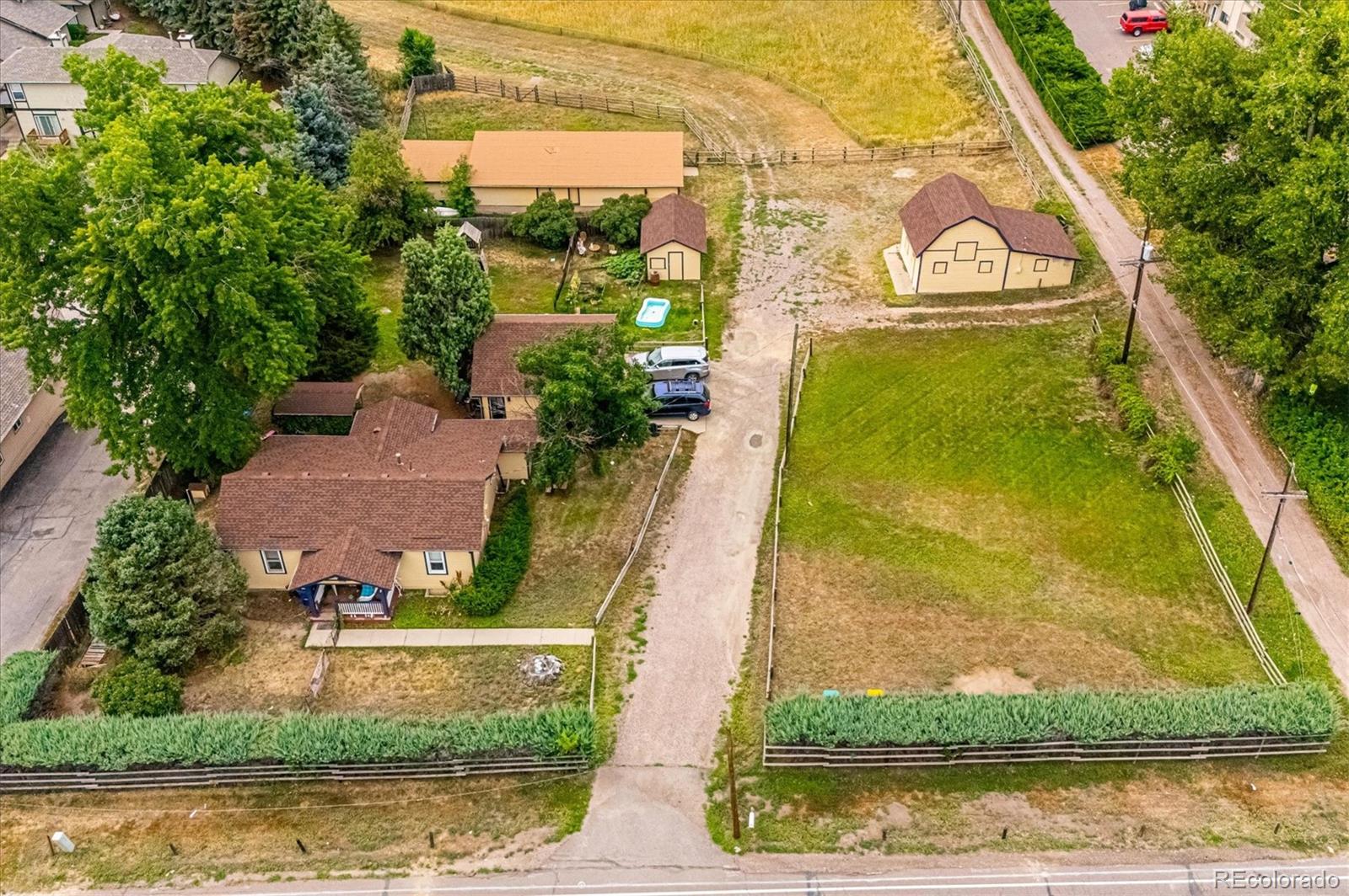 11440 West 38th Avenue Wheat Ridge, CO 80033 - Photo 2 of 18 an aerial view of a residential houses with outdoor space