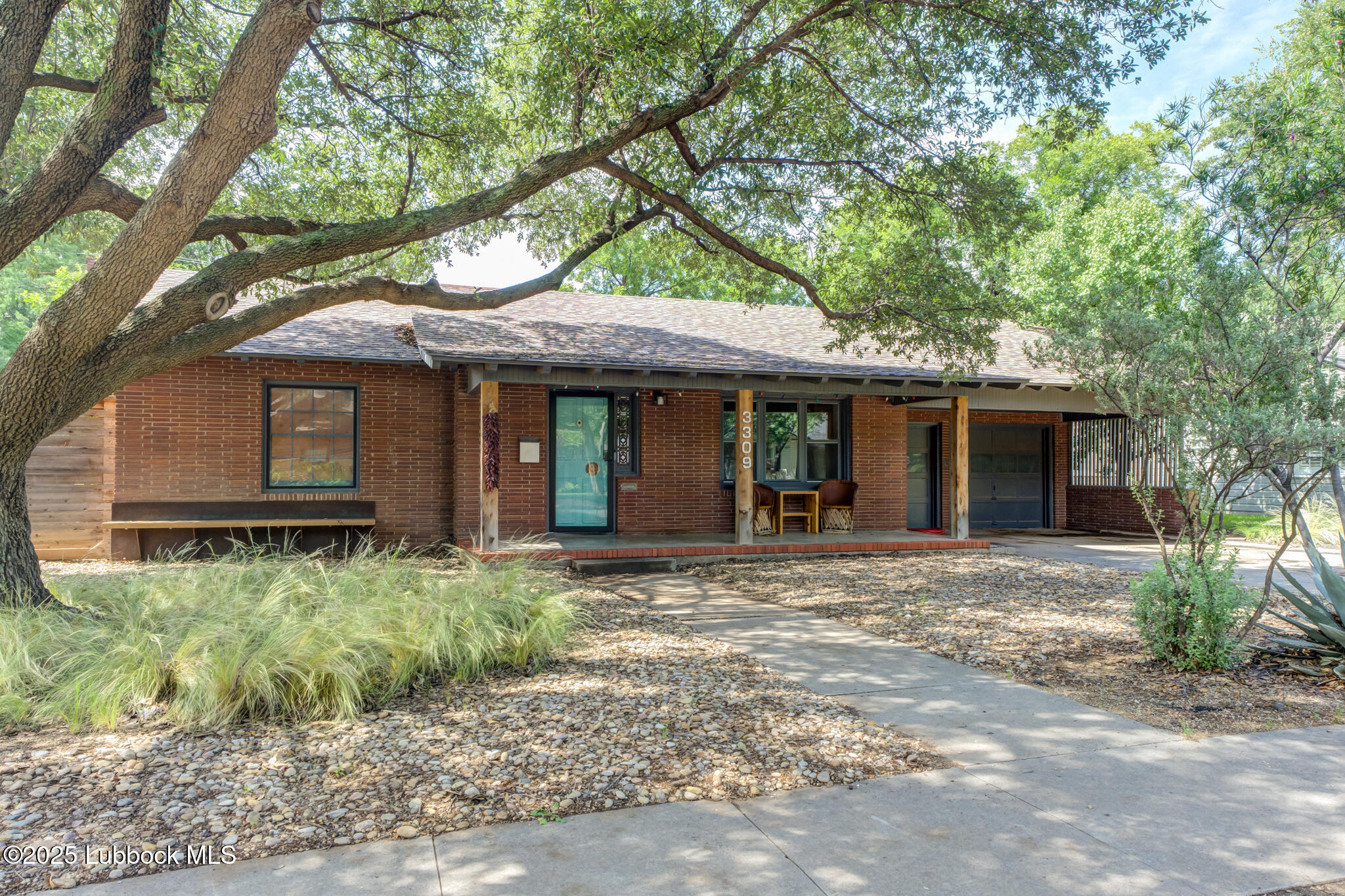 3309 22nd Street Lubbock, TX 79410 - Photo 1 of 37 a front view of a house with garden