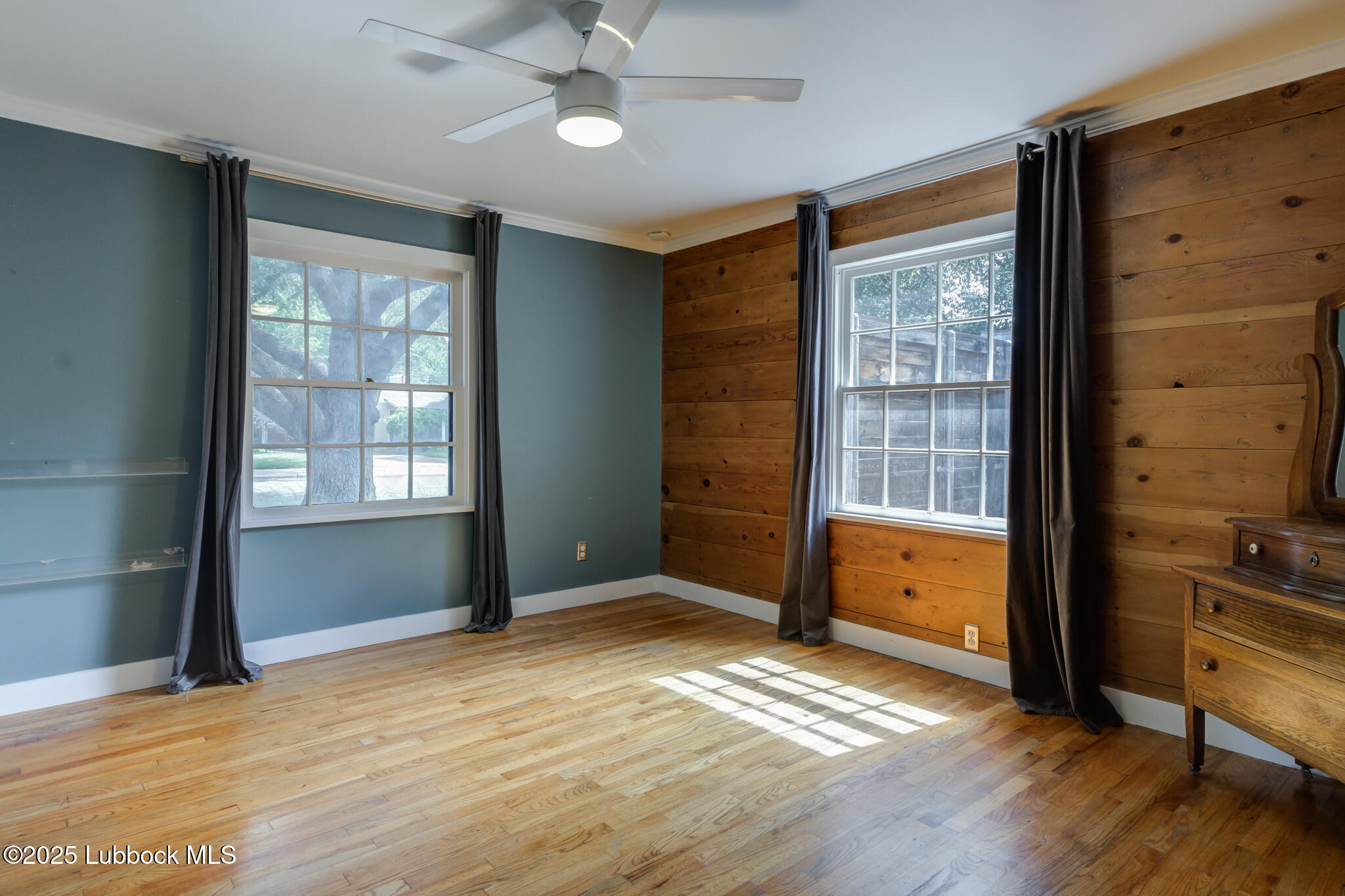 3309 22nd Street Lubbock, TX 79410 - Photo 13 of 37 wooden floor and windows in a room