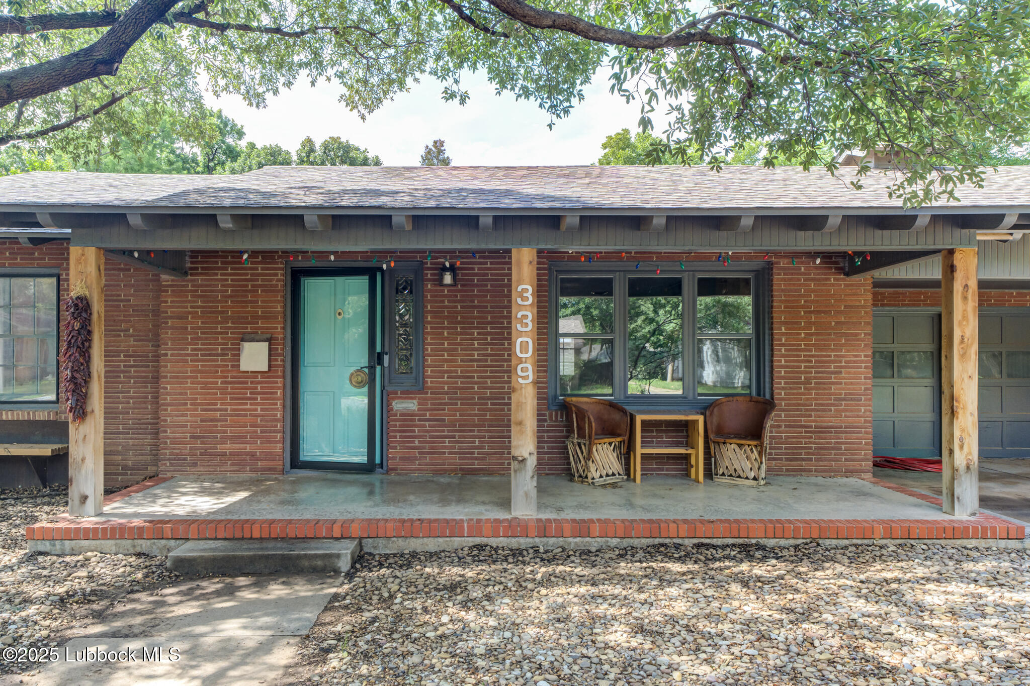 3309 22nd Street Lubbock, TX 79410 - Photo 2 of 37 a backyard of a house with outdoor seating