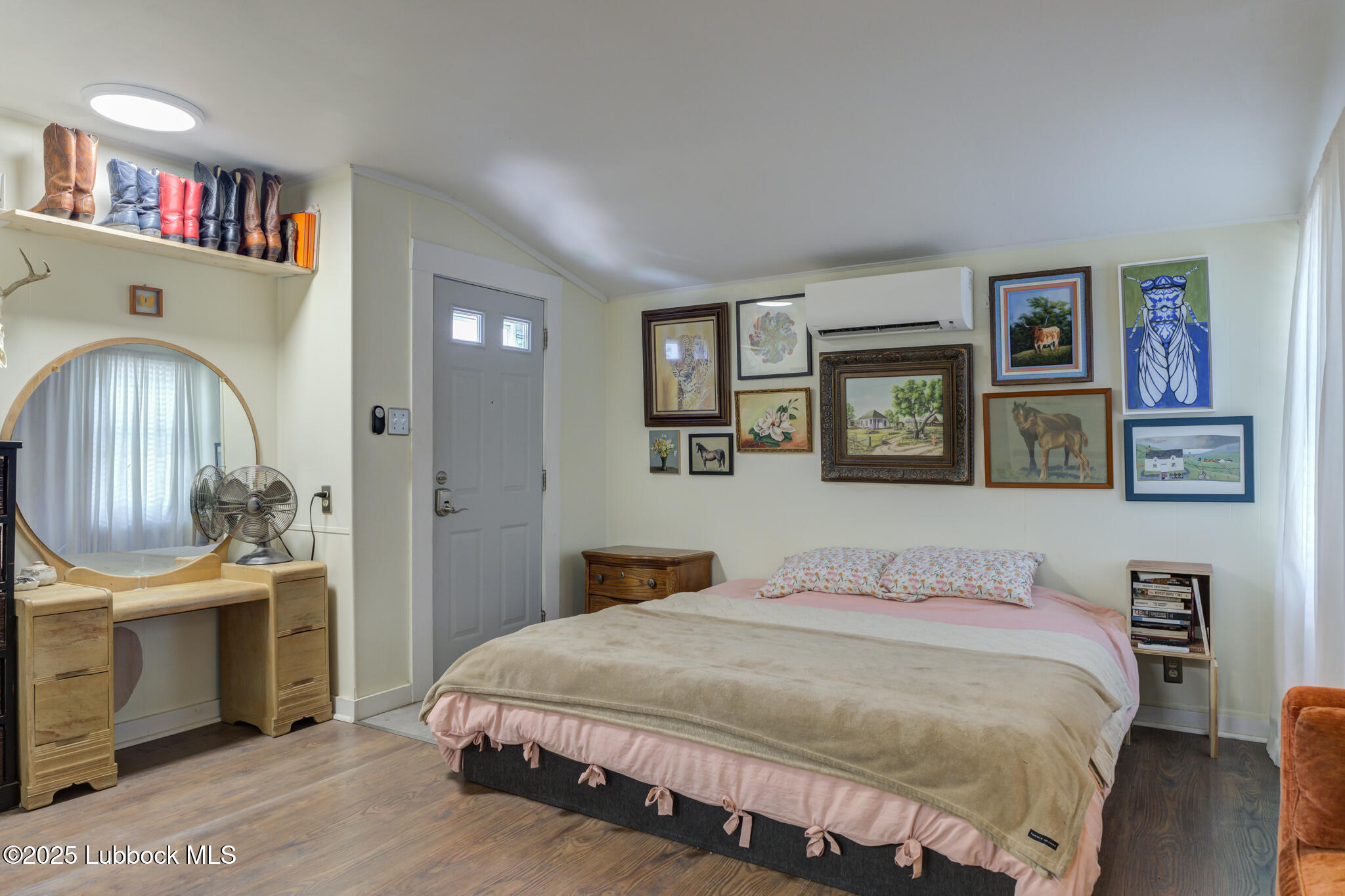 3309 22nd Street Lubbock, TX 79410 - Photo 34 of 37 a bedroom with a bed and a dresser