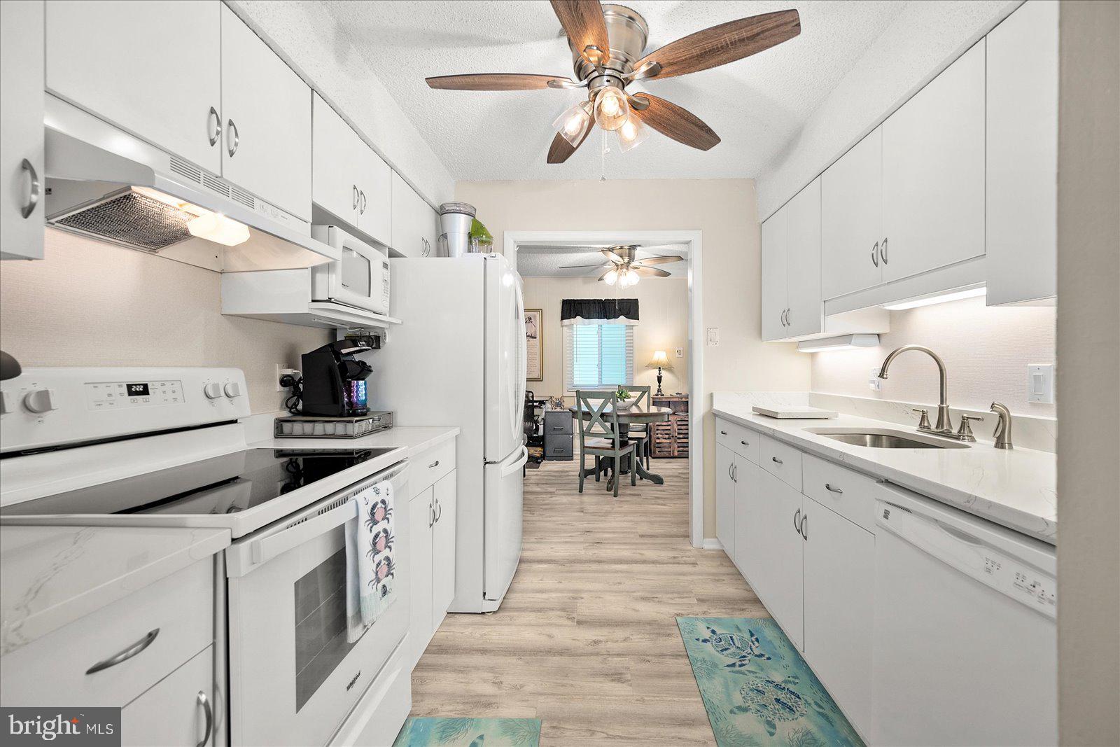 722 Mooring Road, Unit A102 Ocean City, MD 21842 - Photo 11 of 40 Updated kitchen with quartz countertops