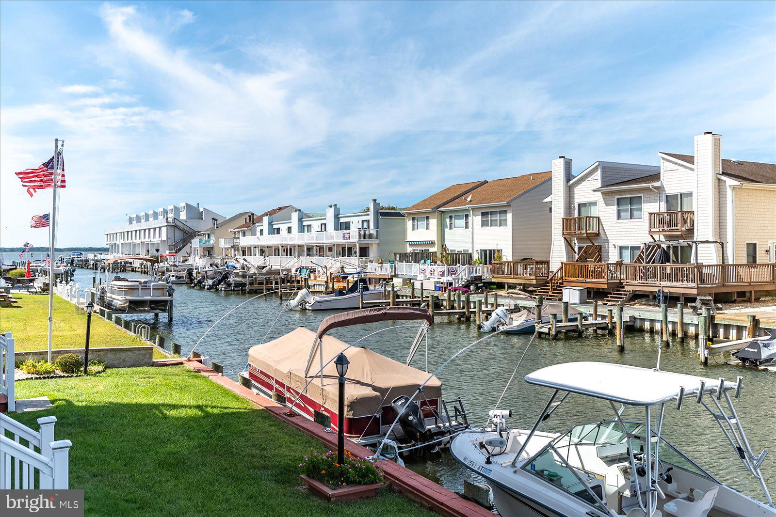 722 Mooring Road, Unit A102 Ocean City, MD 21842 - Photo 33 of 40 Boat slips and grassy area