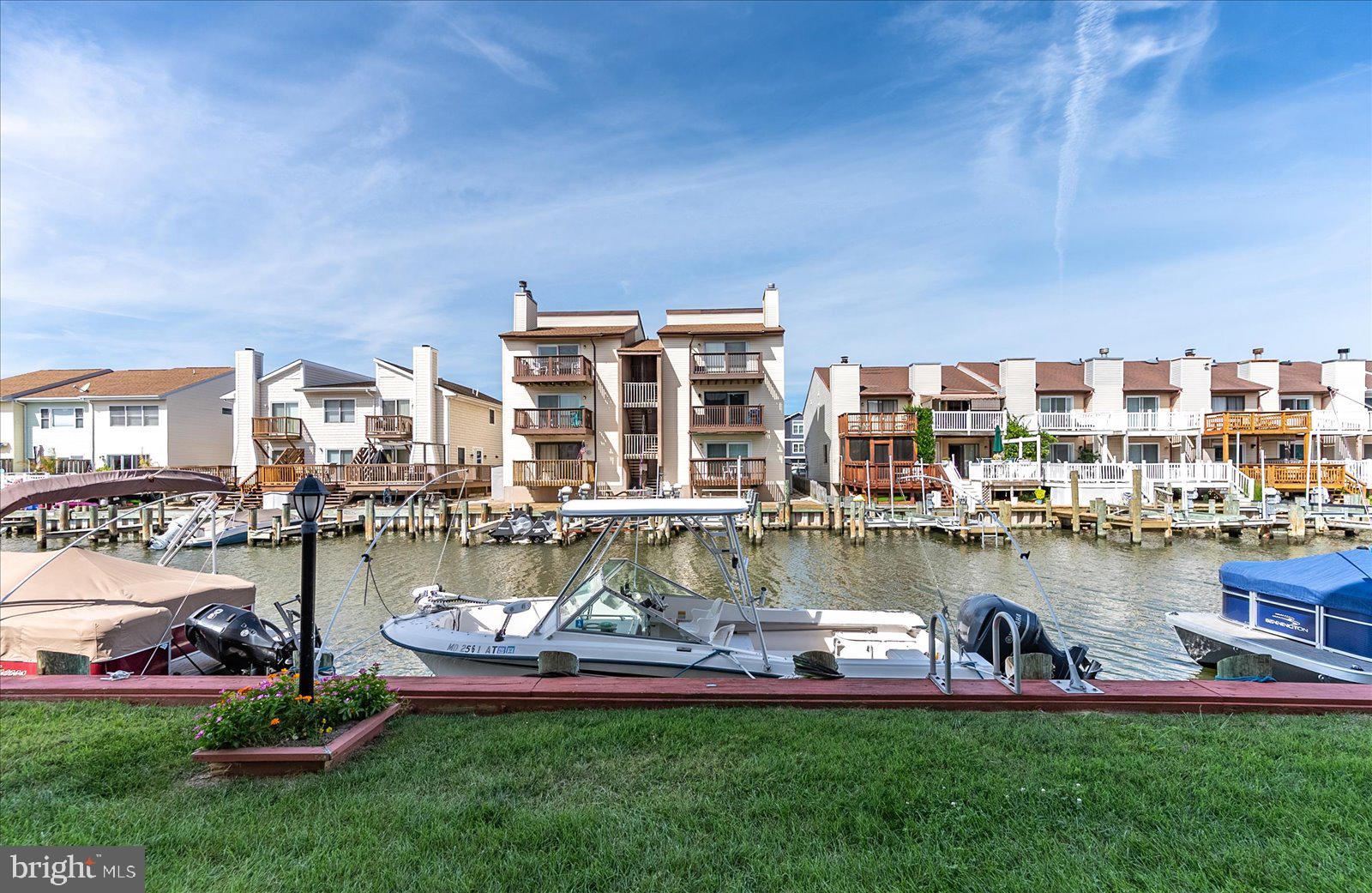 722 Mooring Road, Unit A102 Ocean City, MD 21842 - Photo 35 of 40 Boat slips and grassy area right off your deck