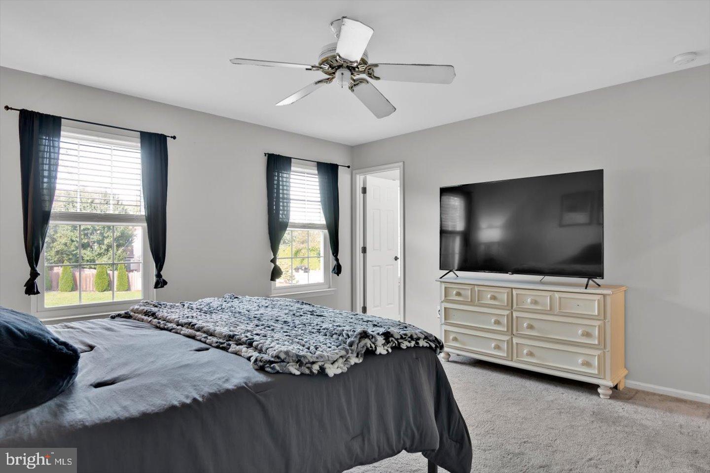 388 Sapling Way Atco, NJ 08004 - Photo 22 of 49 a bedroom with a bed and a flat screen television