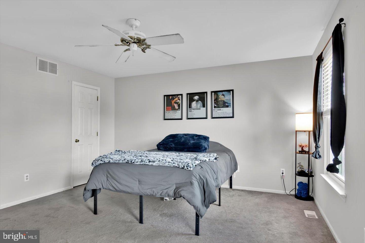 388 Sapling Way Atco, NJ 08004 - Photo 23 of 49 a bedroom with a bed and a flat screen tv