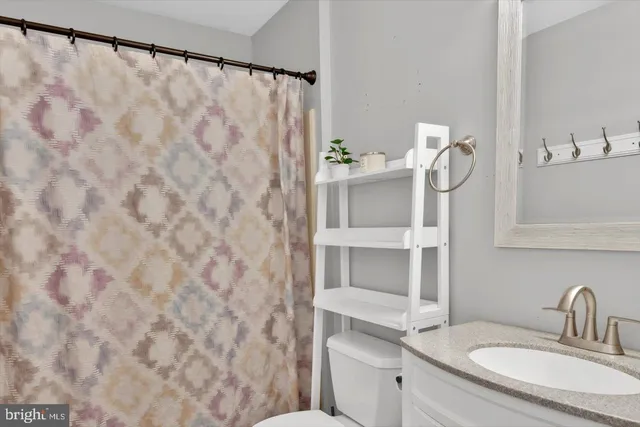 a bedroom with a bed and a flat tv screen