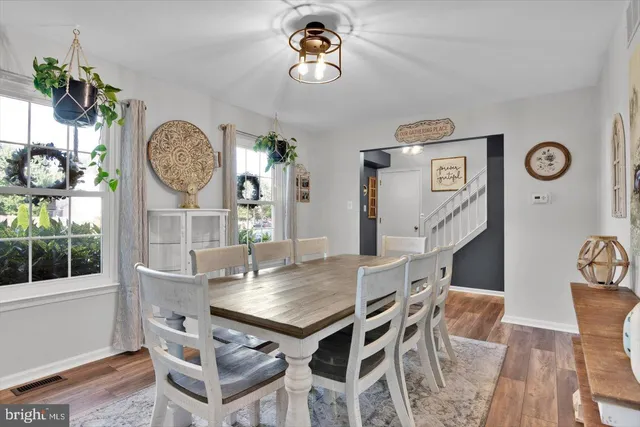 a view of a dining table and chairs in a room