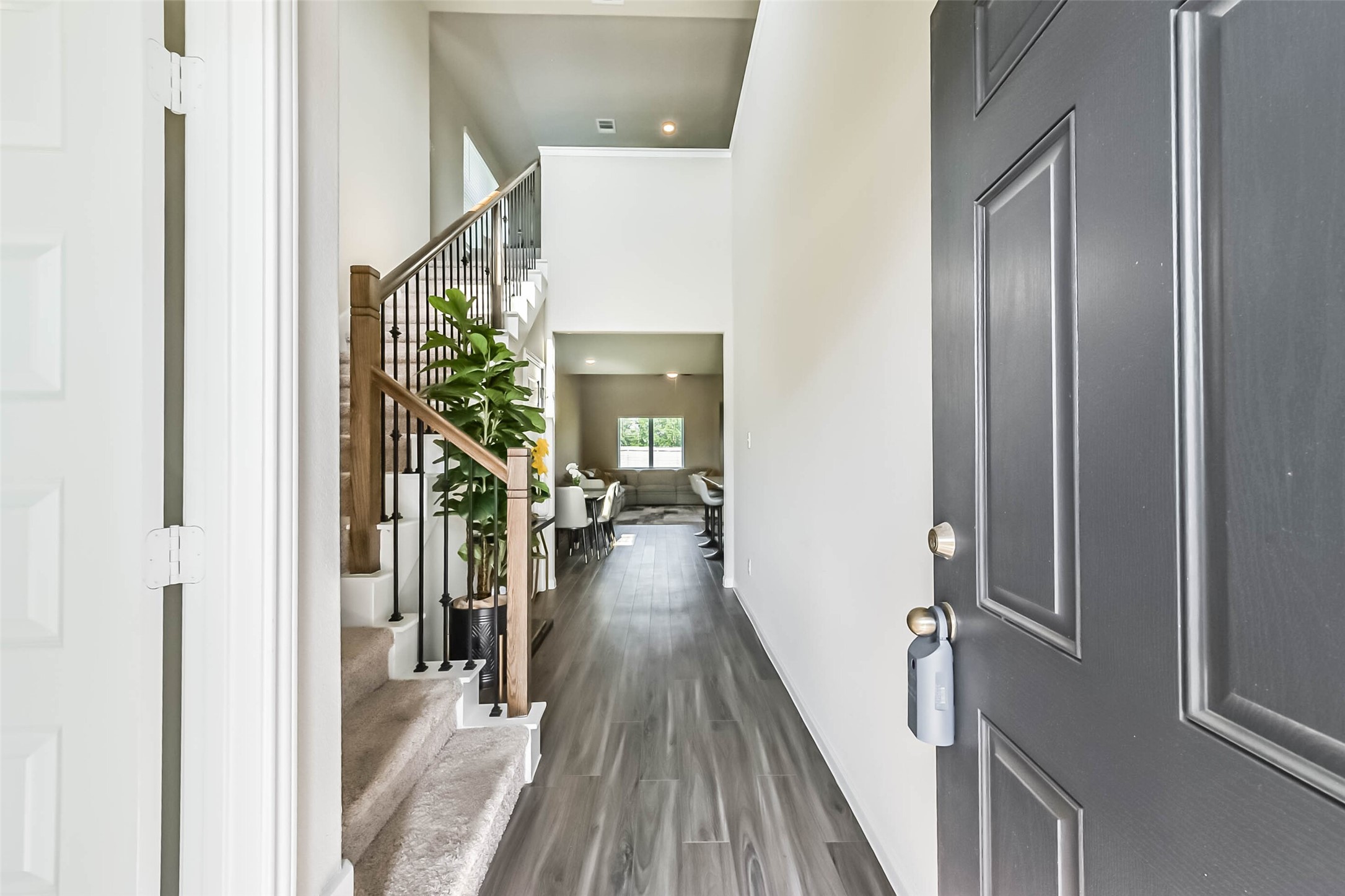 4907 Luke Matthew Drive Rosharon, TX 77583 - Photo 5 of 42 a view of a hallway view with wooden floor and staircase