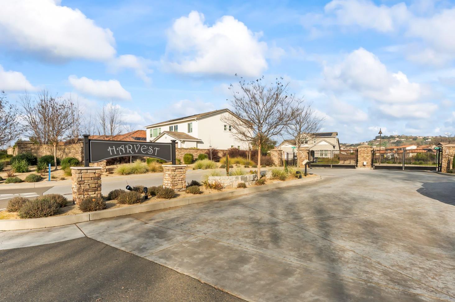 1509 Harvest Loop Folsom, CA 95630 - Photo 19 of 92 HARVEST WELCOMES YOU IN STYLE! Enjoy this super long and wide double gate entry car court. Once you enter the enclave you will enjoy open green space and a roomy community that is well planned. It is what you have been waiting for, but it sold out almost immediately after opening. You can consider this you second chance to own THE ULTIMATE DREAM HOME!