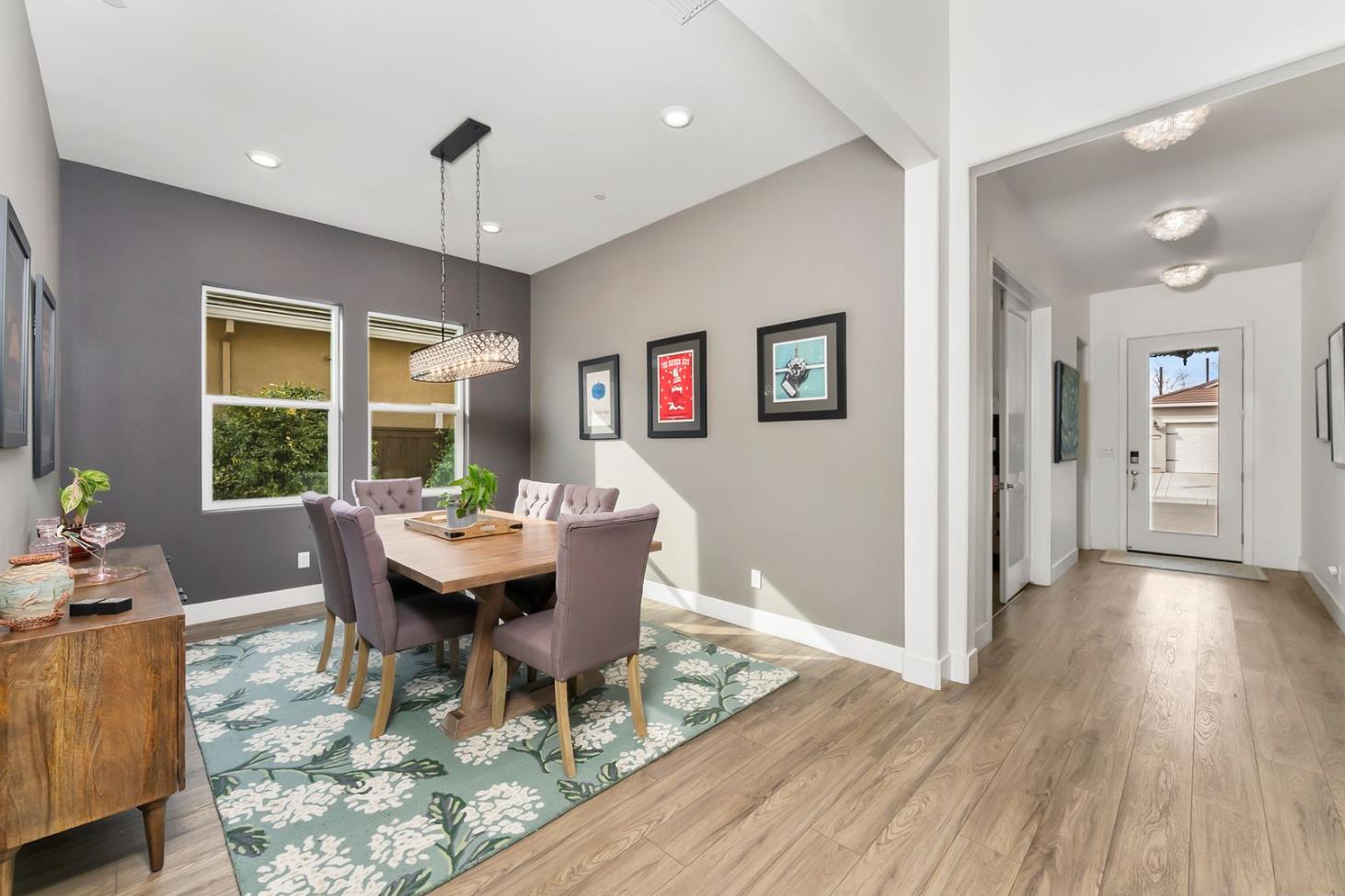 1509 Harvest Loop Folsom, CA 95630 - Photo 28 of 92 THIS FORMAL DINING ROOM could easily accomodate your largest table with up to 8-12 diners. The open concept includes this dedicated niched space for the more perfect dining experience. Warm and cool tones accent walls define the space as extra special, and lends itself to the more intimate memorable meals.