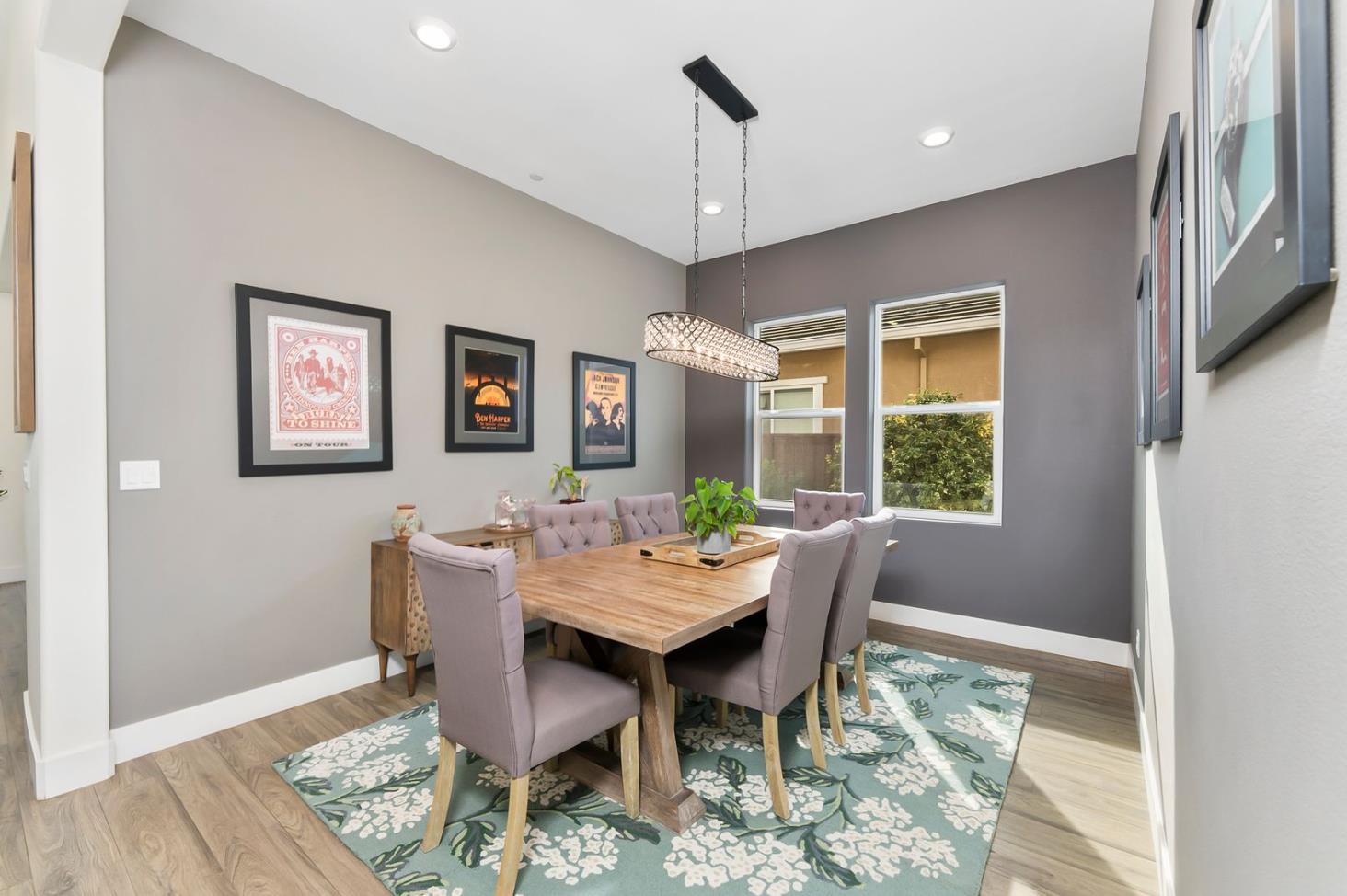 1509 Harvest Loop Folsom, CA 95630 - Photo 29 of 92 THIS FORMAL DINING ROOM could easily accomodate your largest table with up to 8-12 diners. The open concept includes this dedicated niched space for the more perfect dining experience. Warm and cool tones accent walls define the space as extra special, and lends itself to the more intimate memorable meals.