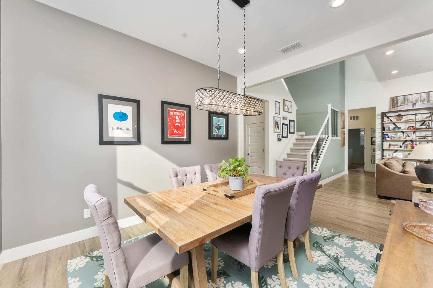 1509 Harvest Loop Folsom, CA 95630 - Photo 31 of 92 THIS FORMAL DINING ROOM could easily accomodate your largest table with up to 8-12 diners. The open concept includes this dedicated niched space for the more perfect dining experience. Warm and cool tones accent walls define the space as extra special, and lends itself to the more intimate memorable meals.