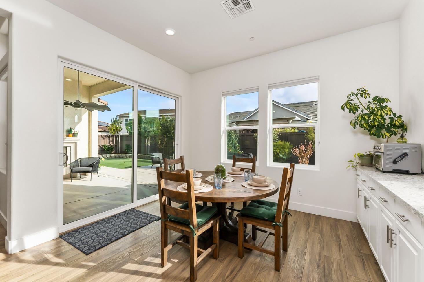 1509 Harvest Loop Folsom, CA 95630 - Photo 38 of 92 IN THE TRADITION OF HARMONIOUS DESIGN, THE GOURMET CHEF KITCHEN meets three criteria, it is magnificent, comfortable and super functional. The height of design, this kitchen meets all three criteria beautifully. The emphasis might appear to be more on form trumps function, when in reality is it the epitome of form follows function! But do not be deceived, this picture perfect kitchen is deceptively hard working. With the extended cabinetry into the breakfast room, to the upgraded designer stainless steel appliances and sleek and sophisticated quartz slab counters. This kitchen is elegant with casual comfort -- creating an environment that will surely be a favorite gathering spot for generations. Please do not miss the large walk in doored pantry!