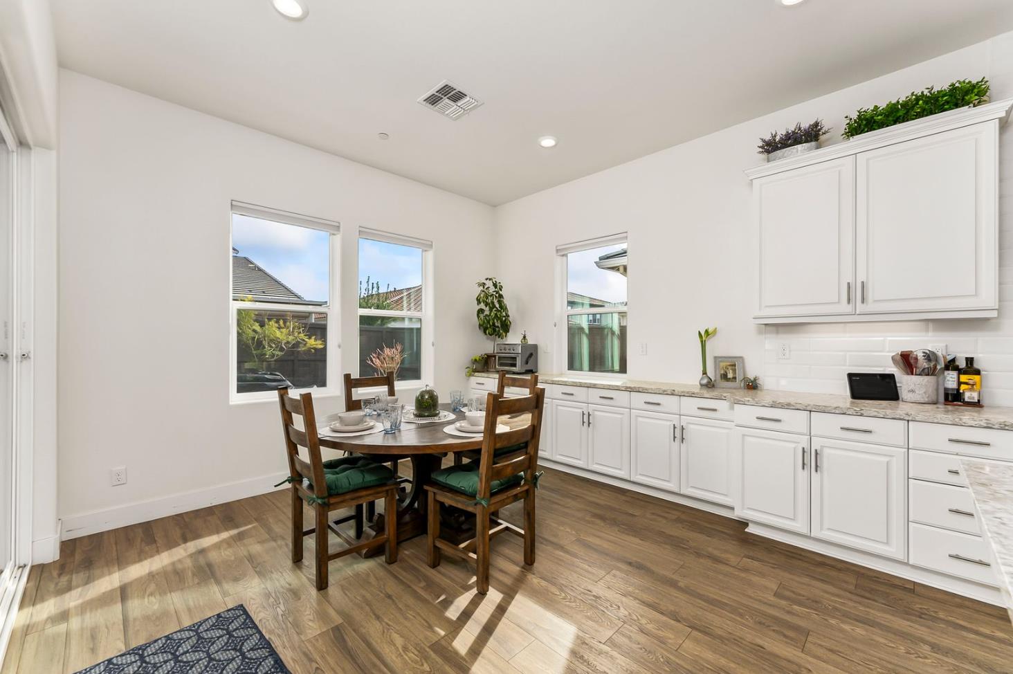 1509 Harvest Loop Folsom, CA 95630 - Photo 40 of 92 IN THE TRADITION OF HARMONIOUS DESIGN, THE GOURMET CHEF KITCHEN meets three criteria, it is magnificent, comfortable and super functional. The height of design, this kitchen meets all three criteria beautifully. The emphasis might appear to be more on form trumps function, when in reality is it the epitome of form follows function! But do not be deceived, this picture perfect kitchen is deceptively hard working. With the extended cabinetry into the breakfast room, to the upgraded designer stainless steel appliances and sleek and sophisticated quartz slab counters. This kitchen is elegant with casual comfort -- creating an environment that will surely be a favorite gathering spot for generations. Please do not miss the large walk in doored pantry!