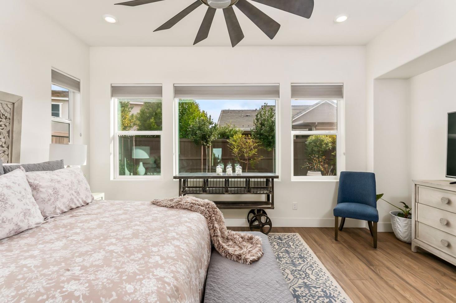 1509 Harvest Loop Folsom, CA 95630 - Photo 51 of 92 THE PRIMARY ENSUITE is only rivaled by it Junior Primary Ensuite. What they both have in common, they are both on the ground floor. That is almost impossible to find! No more stairs just to go to bed, lol. It's true, hard to appreciate until you have it, and sorely missed when you do not. Flood with natural light, and overlooking the rear yards and gardens of the lanai.